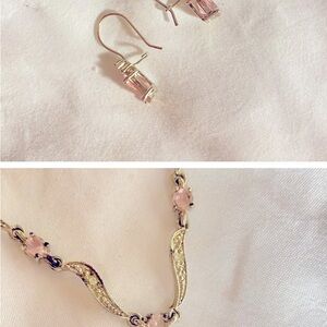 Silver colored necklace and earring jewelry set.